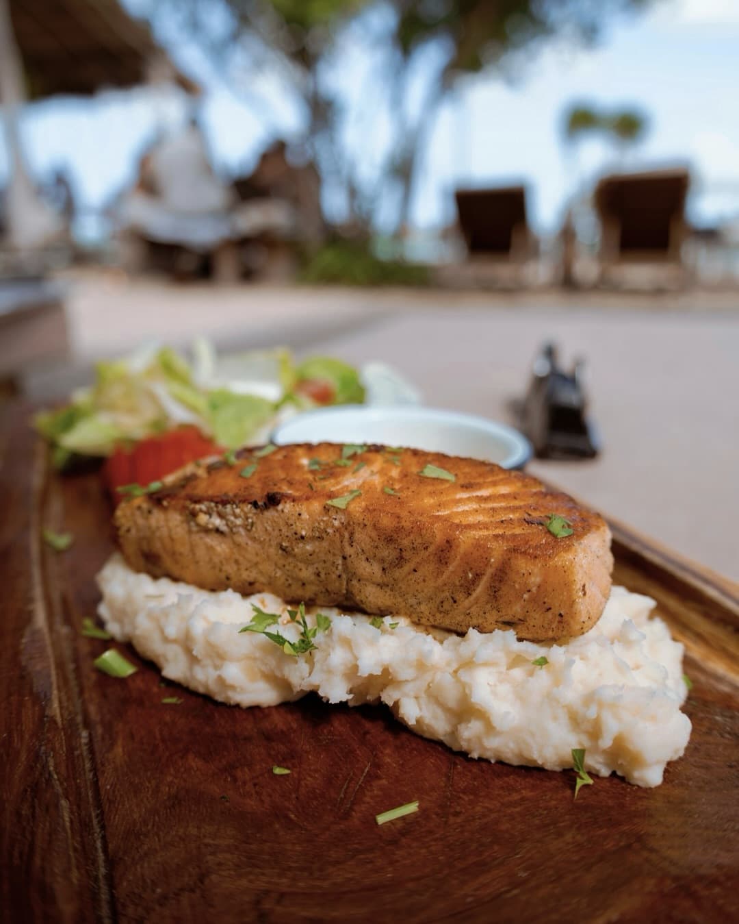 Chef preparation of fresh salmon plate